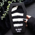 Striped socks in coffin box